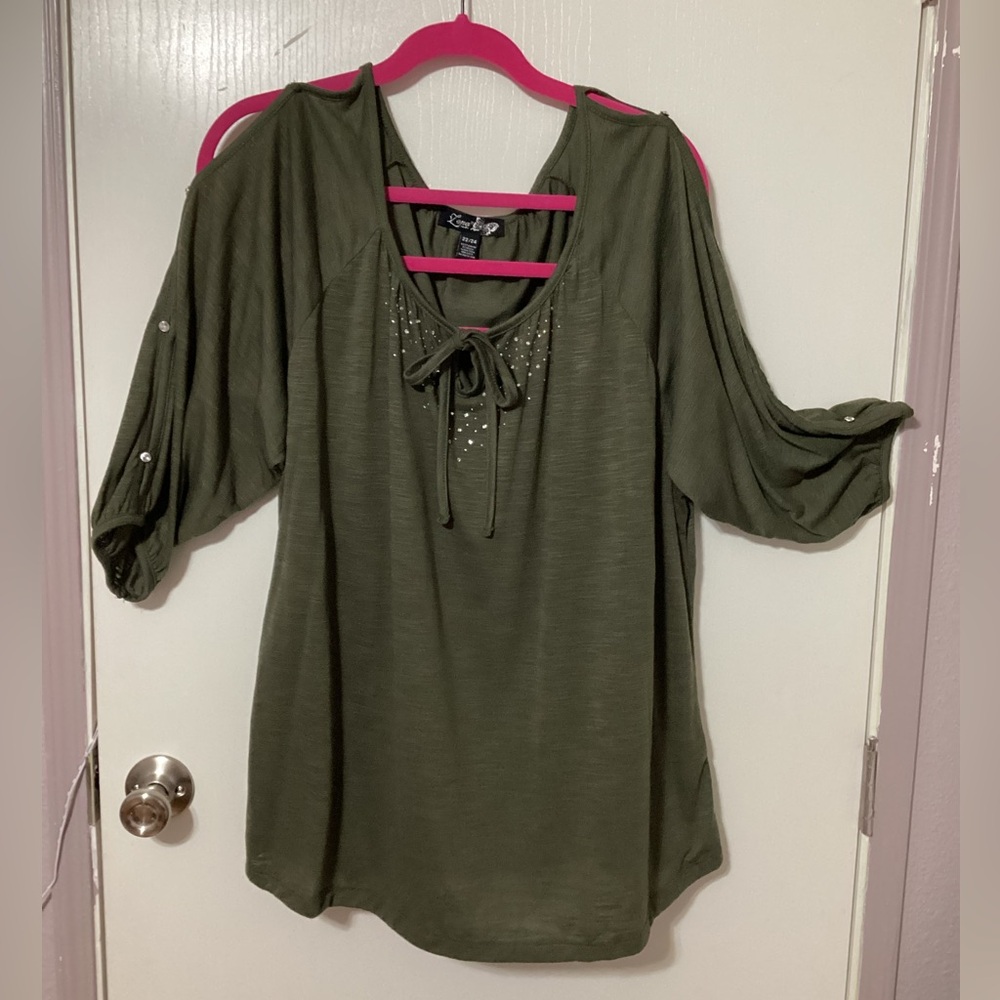 Fun blouse with rhinestones and slits down the sleeves